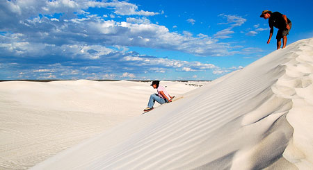 Me sandboarding on the dune, face forward